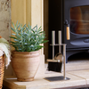 Lifestyle image Valiant brushed steel Petite Companion Set next to a wood burning stove