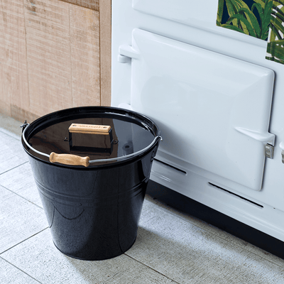 Lifestyle image of Valiant Fireside Bucket closed in kitchen, next to Aga